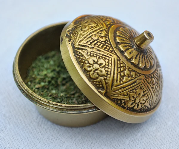 Brass box with dried grass — Stock Photo, Image