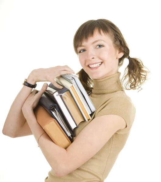 Flicka med en hög med böcker — Stockfoto