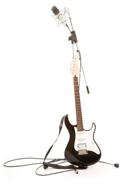 Guitar and stand with a microphone clipart