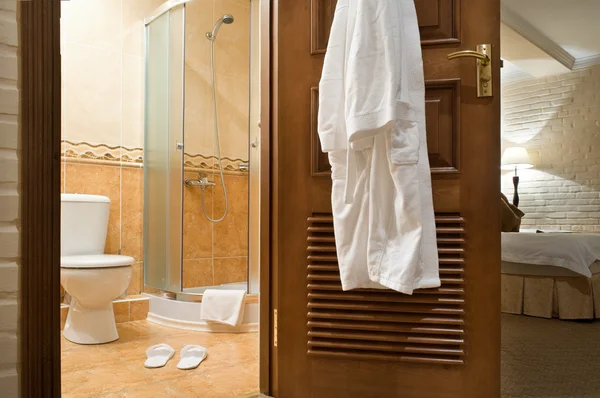 WC, bathrobe, shower cubicle. — Stock Photo, Image