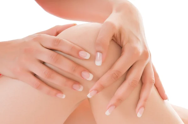 Dotyka kobiet kolana palce — Zdjęcie stockowe