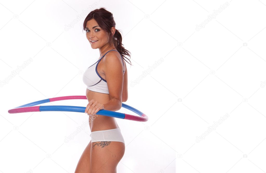 Women exercise hula hoop
