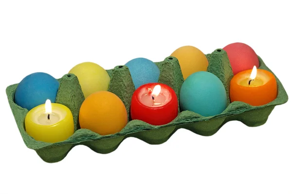 Easter eggs and candle. — Stock Photo, Image
