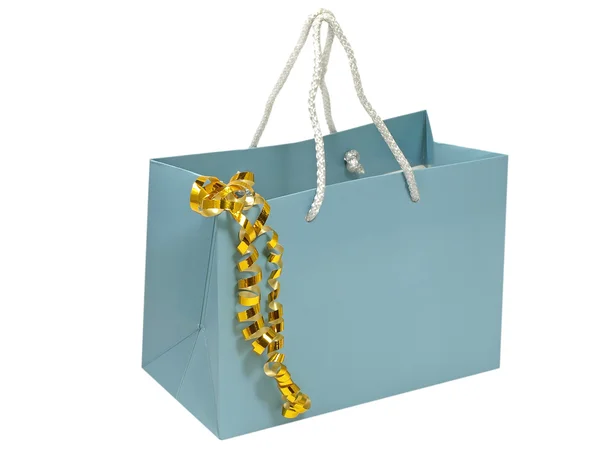 Saco de presente azul com fita decorativa dourada . — Fotografia de Stock