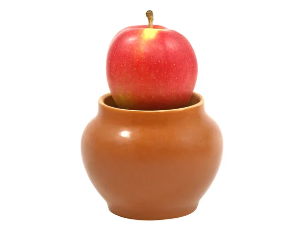 Fresh red apple in a clay pot. — Stock Photo, Image