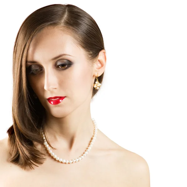 Beautiful face of young woman with pearl necklace. — Stock Photo, Image