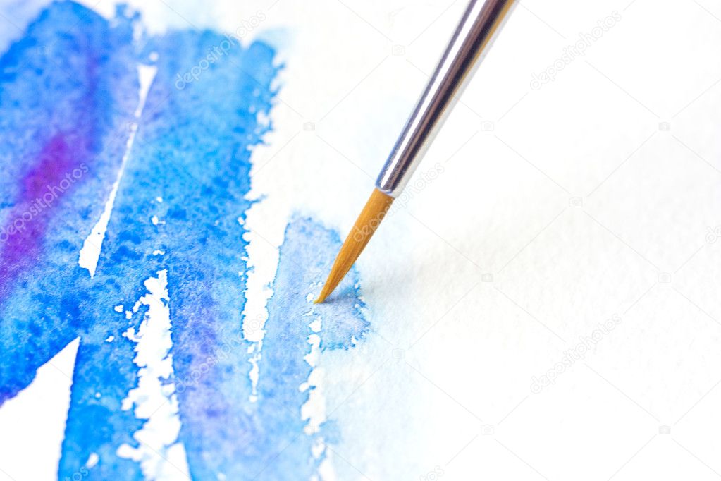 Watercolor brush with blue paint