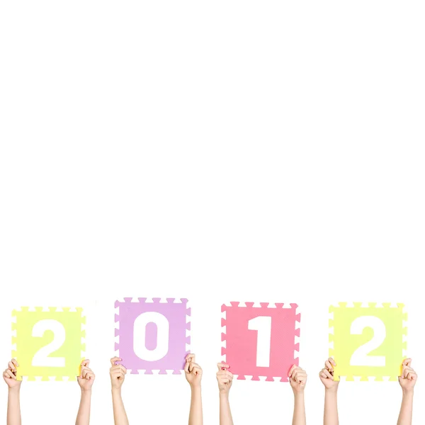 Kinderen houden 2012 Nieuwjaar — Stockfoto
