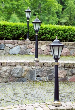 Metal old style lamp for street lighting clipart