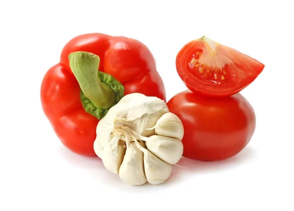 Tomaat, peper en knoflook op een witte achtergrond Stockfoto