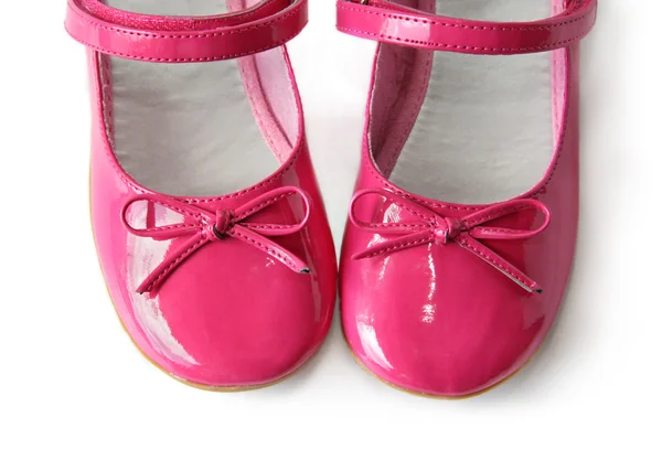 Zapatos de charol con lazos sobre fondo blanco — Foto de Stock