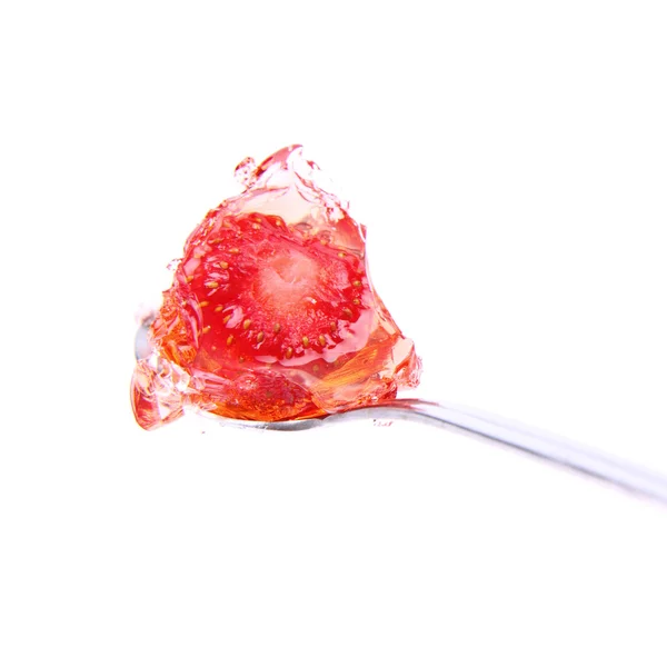 Strawberry jelly on a spoon — Stockfoto