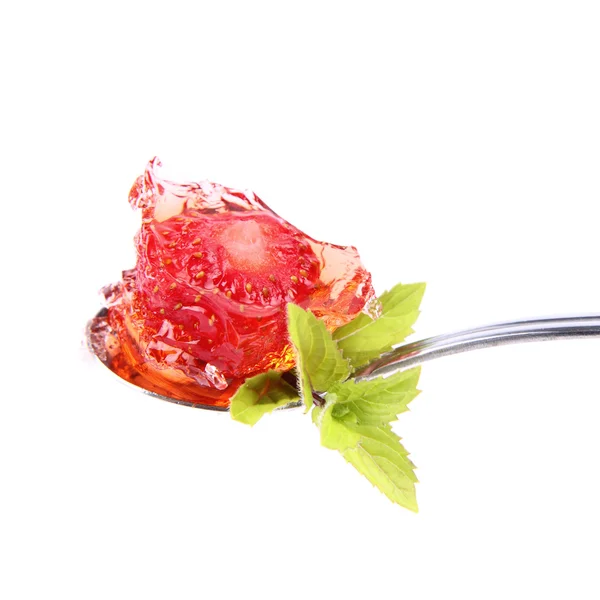 Strawberry jelly on a spoon — Stockfoto