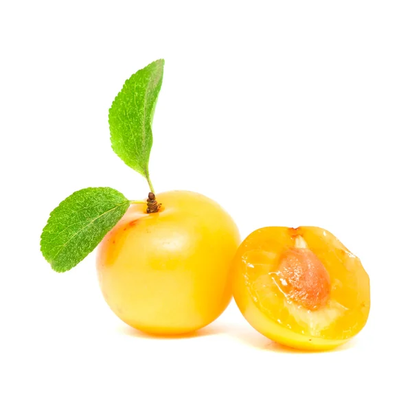 Fresh plum and a half with leafs — Stock Photo, Image