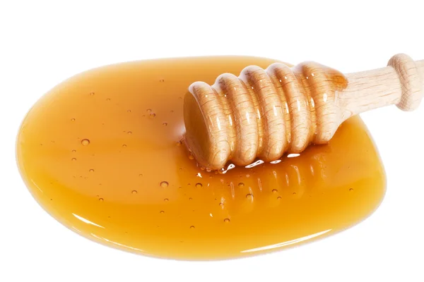 蜂蜜の水たまりに蜂蜜ディッパー — ストック写真