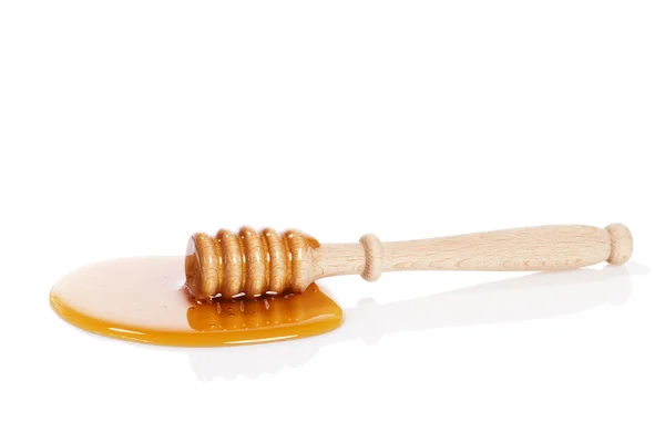 Tuffatore di miele in una pozzanghera di miele — Foto Stock