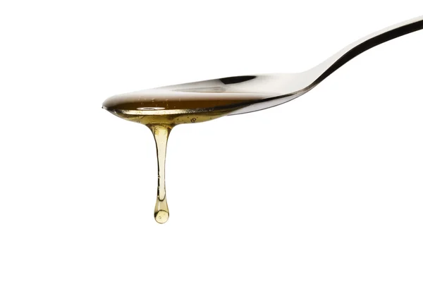 Las gotas de miel de la cuchara — Foto de Stock