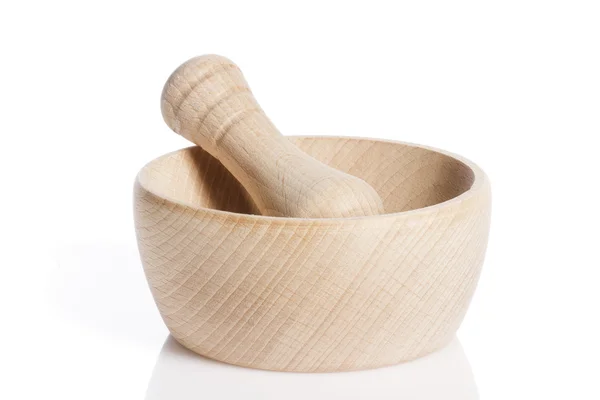Wooden pestle in a mortar — Stock Photo, Image