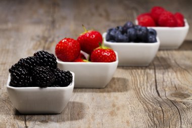 Bowls with wild berries clipart