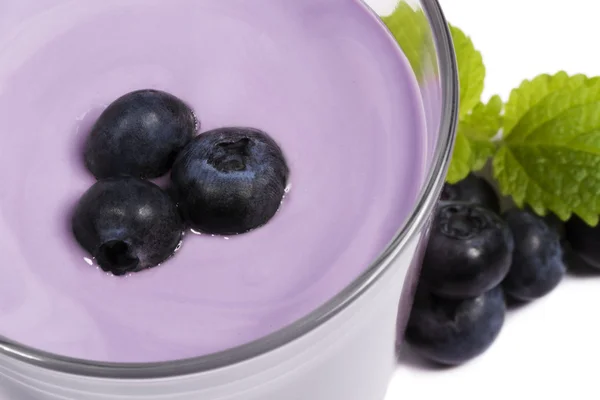Blueberries on top of a blueberry milkshake with blueberries aside — Stock Photo, Image