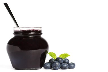 Jam jar with blueberry jam a spoon and blueberries with a leaf melissa clipart