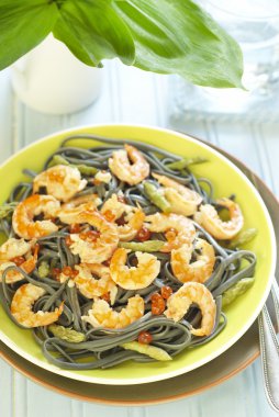 Pasta with shrimps, red caviar and asparagus clipart