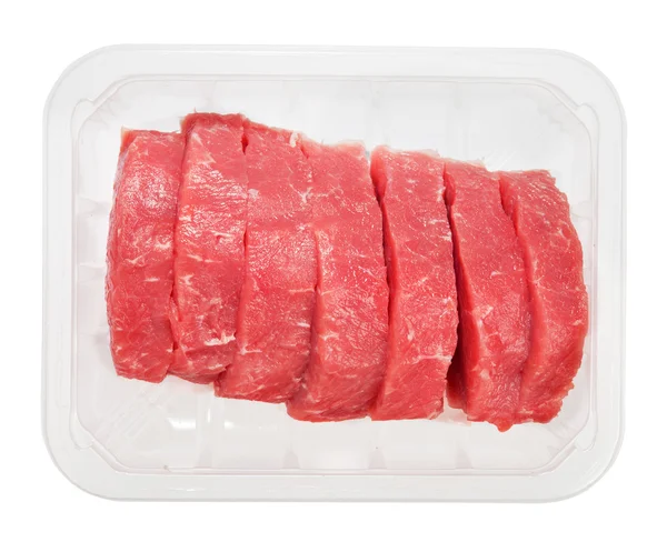 Les morceaux de steaks de filet crus en boîte isolée sur blanc — Photo