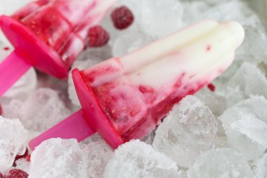 Resfreshing raspberry ice popsicles clipart