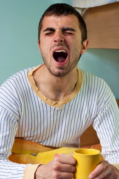 Yawning in bed — Stock Photo, Image