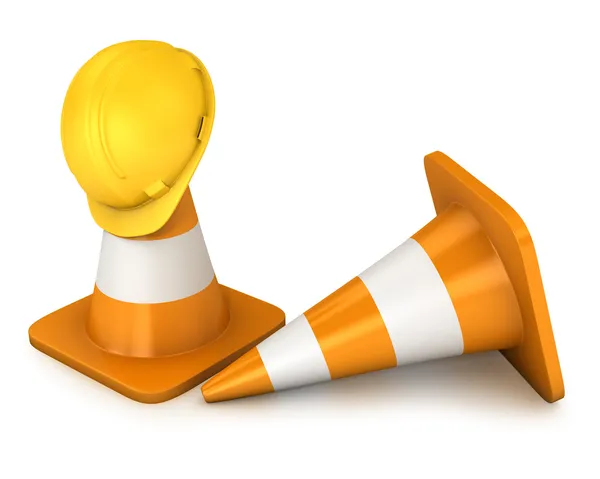 Dos conos de carretera y casco amarillo —  Fotos de Stock