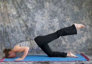 Woman doing Yoga posture sunbird pose left clipart