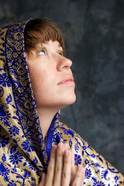 stock image Beautiful woman with shawl on head looking up and praying