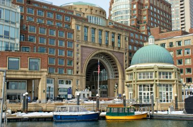 Water taxis inside historic rowes wharf in boston massachusetts clipart