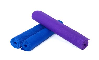 Three rolled exercise yoga mats on white clipart