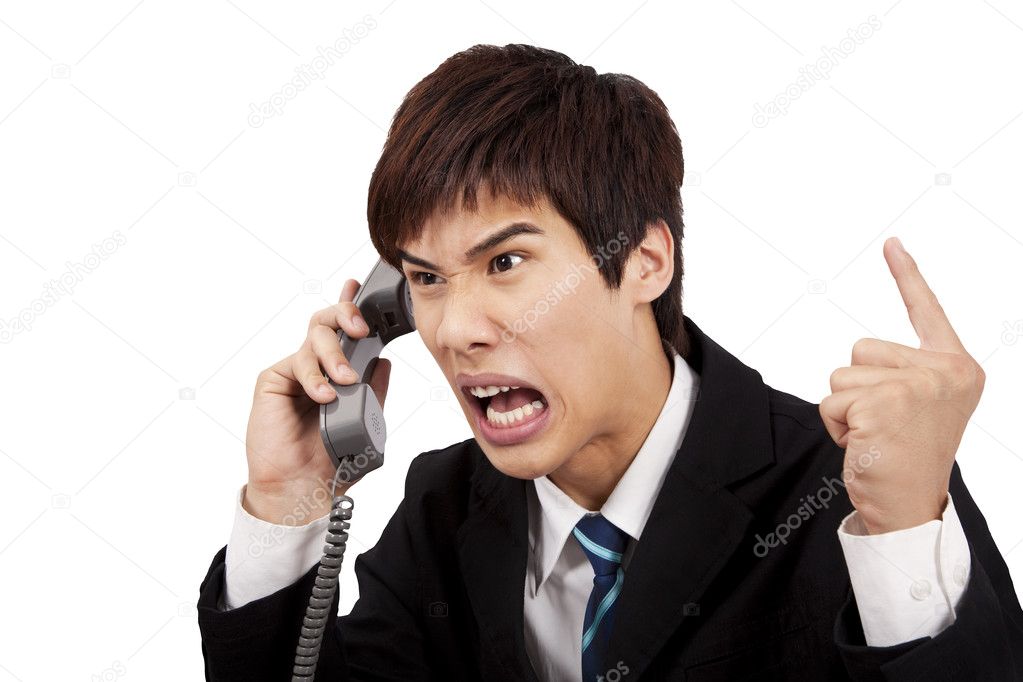 Angry businessman screaming on the phone and isolated on white background