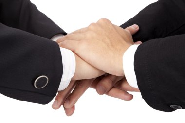 Trust and cooperation concept. stacked hands of businessman clipart