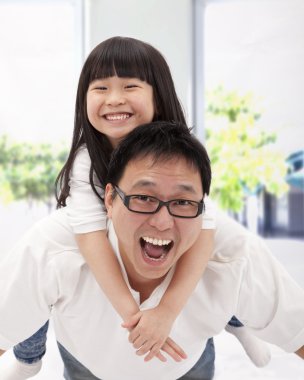 Happy asian family. father and little girl clipart