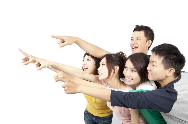 快乐亚洲年轻组指向离开隔离在白色背景上 — 图库照片