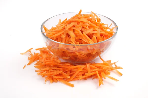 Grated carrots in a glass cup — Stock Photo, Image