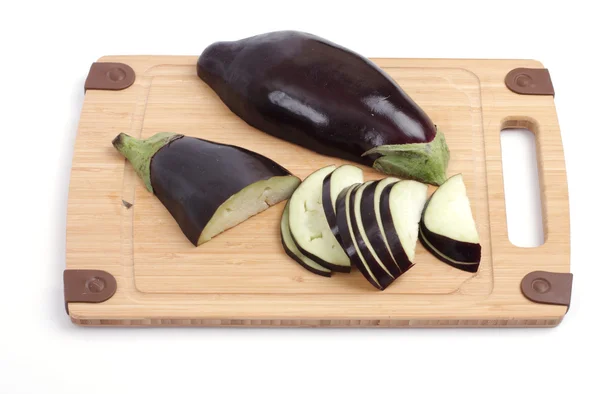 Eggplant on a wooden board. Studio isolated. — Stock Photo, Image