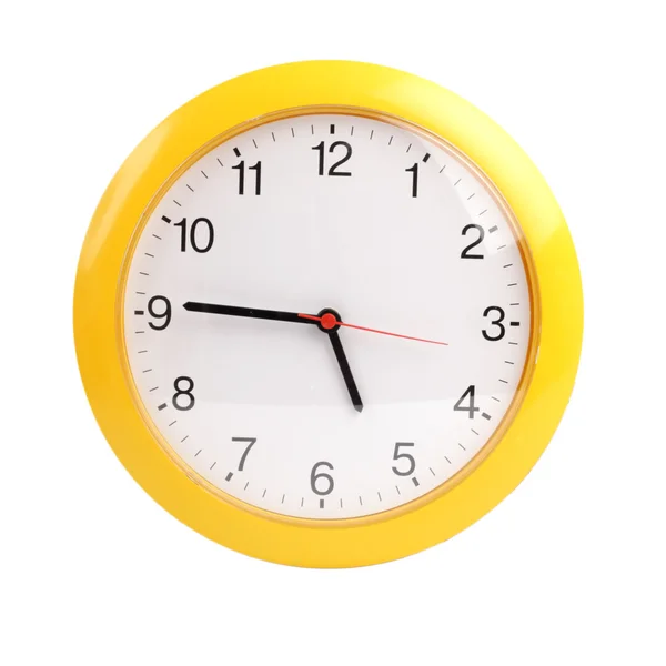 Amarelo, redondo o relógio sobre um fundo branco — Fotografia de Stock