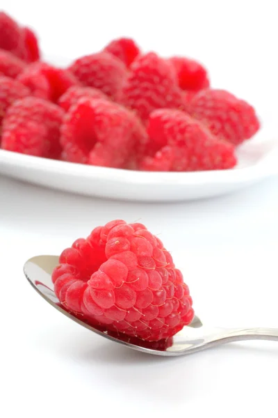 Fresh raspberries over white — Stock Photo, Image