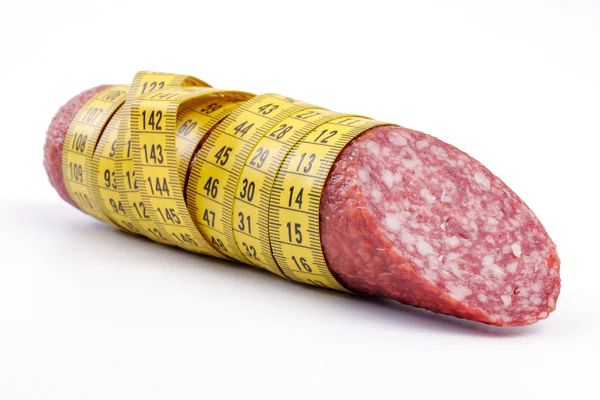 Колбаса с измерительной лентой — стоковое фото