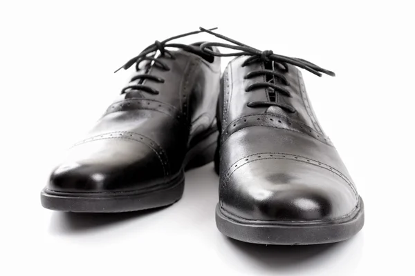 Schwarze Stiefel auf weißem Hintergrund — Stockfoto