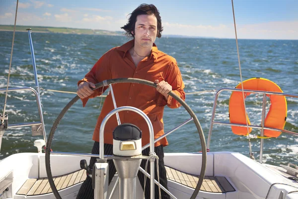 Stock image Young Man is Sailboat Captain