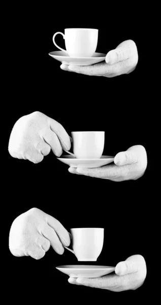 Stock image Someone wearing white gloves with a cup of coffee