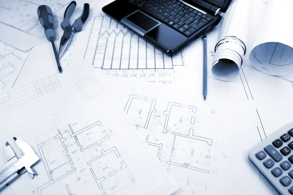Blueprints background with computer and tools / blue toned — Stock Photo, Image