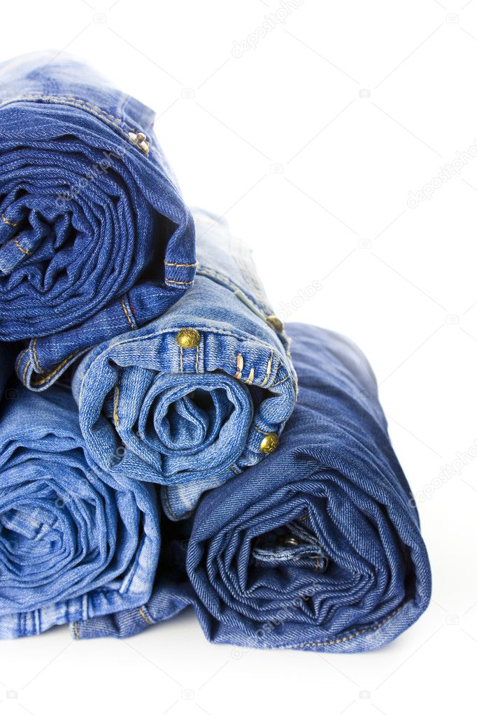 Rolls of Blue Jeans isolated on white background