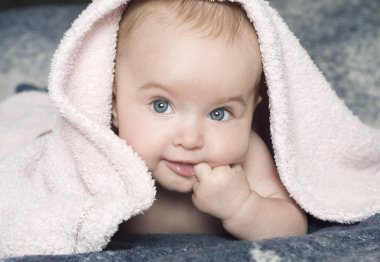 Baby with a towel clipart