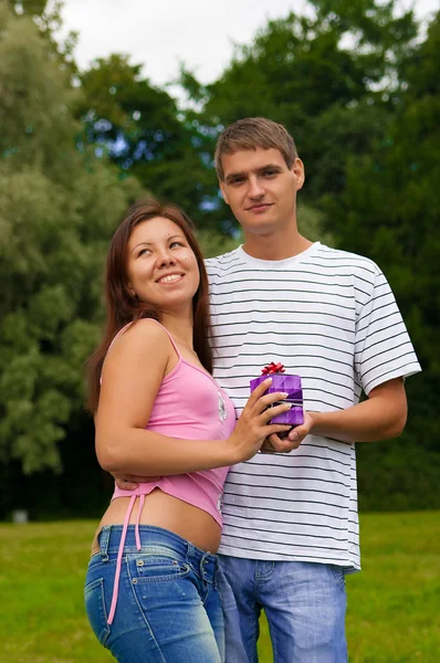Young Man Giving Present To Girlfriend — Stock Photo, Image